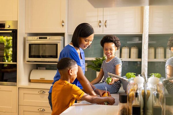 Family Getting Fresh Water from Faucet