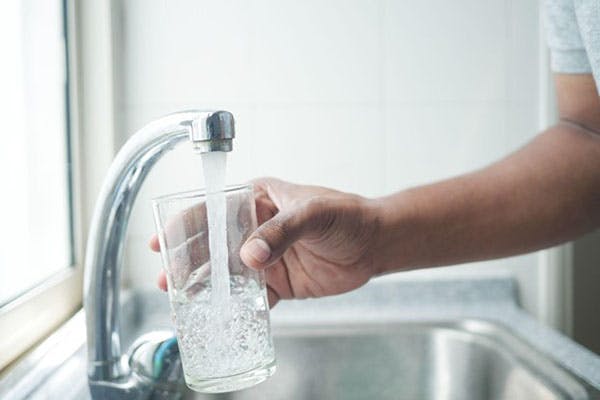 Aurora’s Tap Water Woman Pours from Faucet