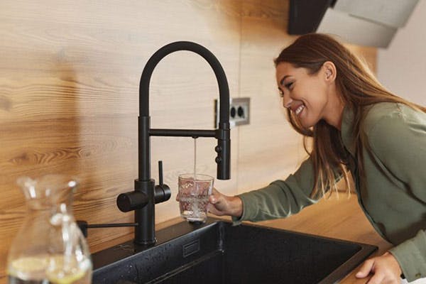 Fresh Drinking Water from Faucet Smiling Woman