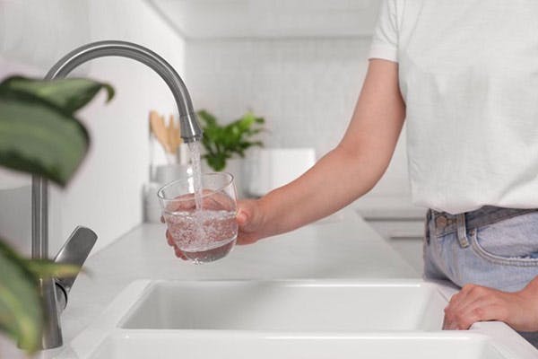 Fresh Water Filter Man Holds Glass