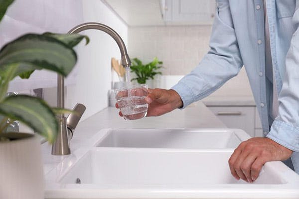 Tap Water in Jacksonville Florida Man Holds Glass