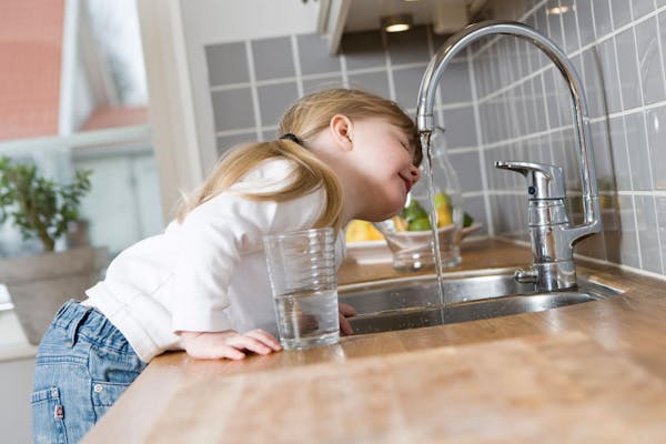Girl Drinking from Filtered Tap Water