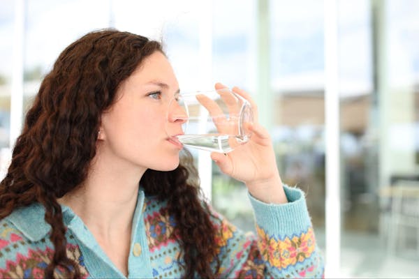 Woman Drinking Filtered Water