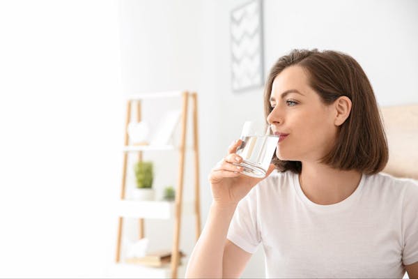 Woman Drinking Filtered Water