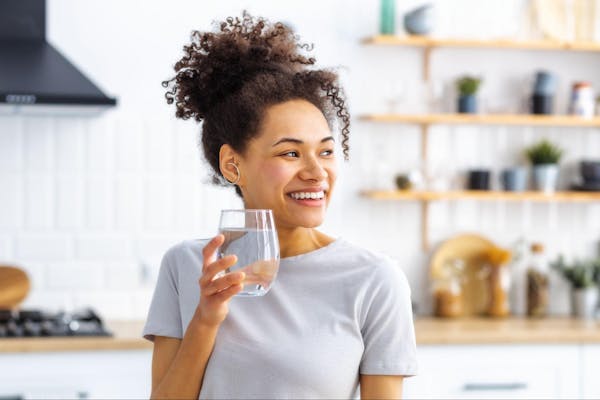 Woman Drinking Filtered Water
