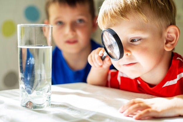 Deionized Water Purification Children Looking at Glass