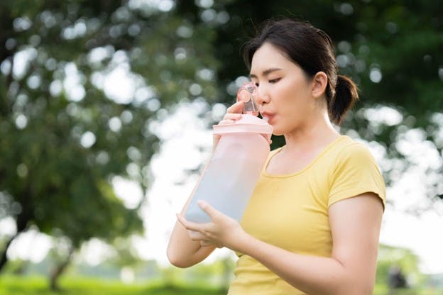 Woman Drinking A lot of Water To Help Kidneys