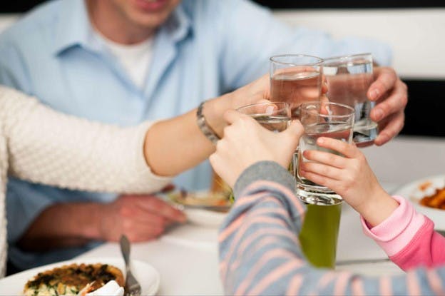 Family Celebrates Great Water Quality With a Toast