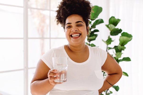 Water Filtration Systems and Image of Woman Smiling