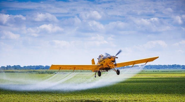 Water Pesticides Airplane Sprays Over The Field