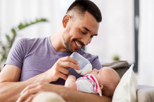 Father Feeds Baby from Bottle