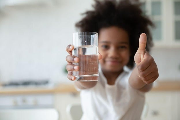 HomeWater vs Waterdrop Filters Child Image Gives Approval on Water Test