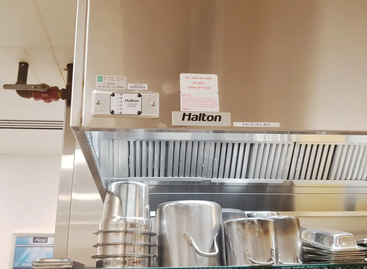 Shiny clean commercial kitchen indoor exhaust hood 