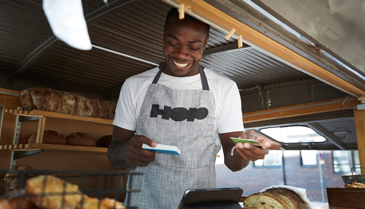 Smiling man with EPOS terminal
