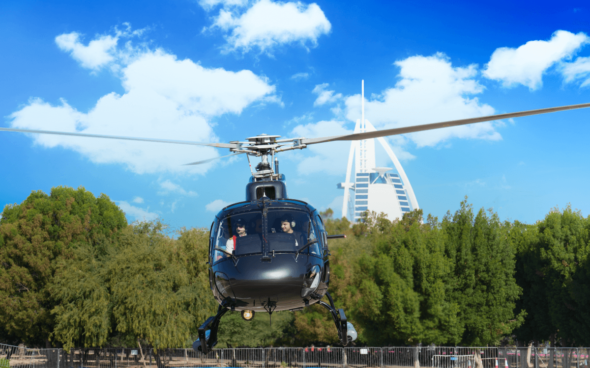 Helicopter taking of with background the Burj al Arab