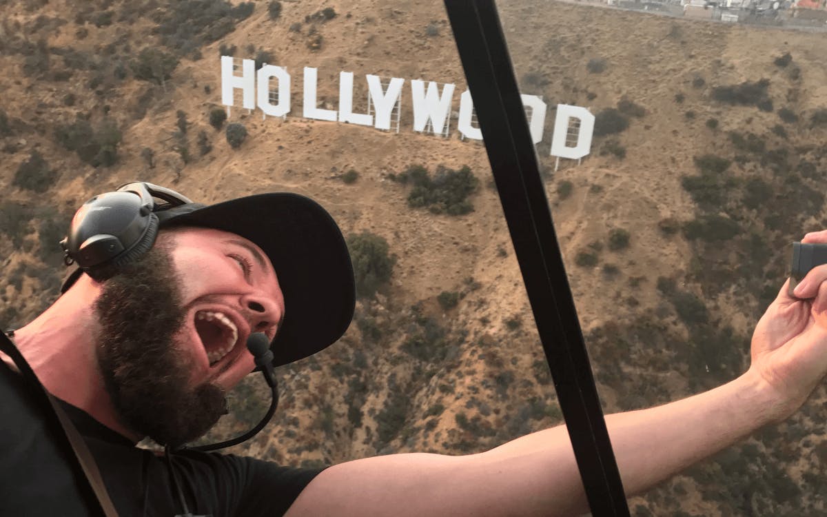 Passengers Inside the helicopter with the Hollywood sign in the Background