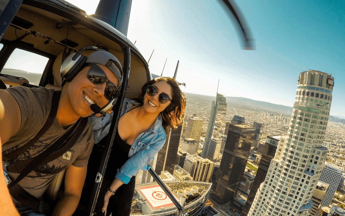 Passengers Inside the helicopter with LA skyscrapers in the background