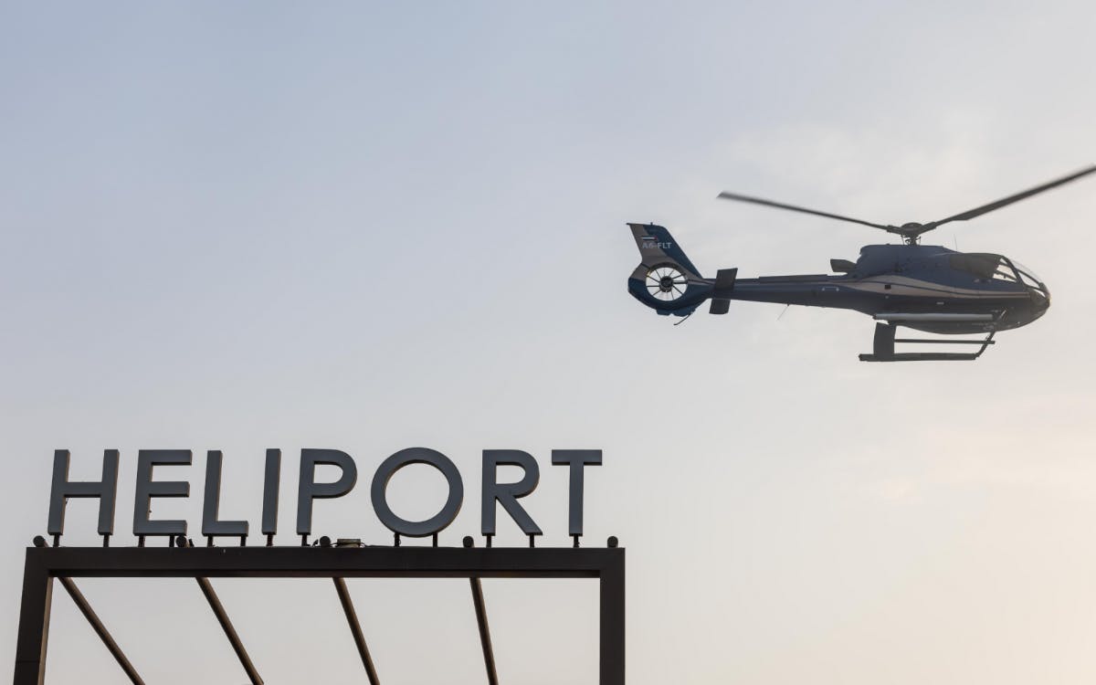Helicopter Flying above the heliport