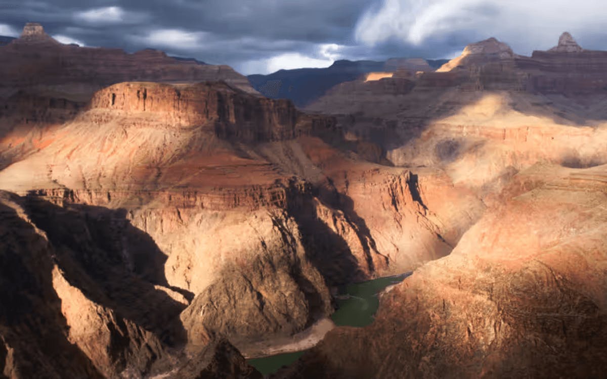 Grand Canyon cliffs with the Colorado River flowing through the canyon