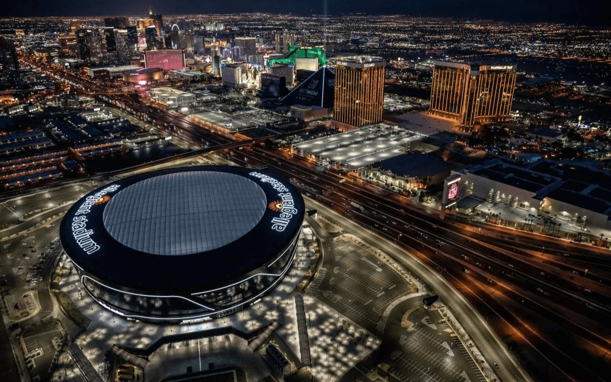 View of Allegiant Stadium and Luxor Pyramid from helicopter at night