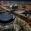 View of Allegiant Stadium and Luxor Pyramid from helicopter at night
