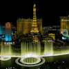 Bellagio fountains with the Eiffel Tower behind, view from helicopter at night