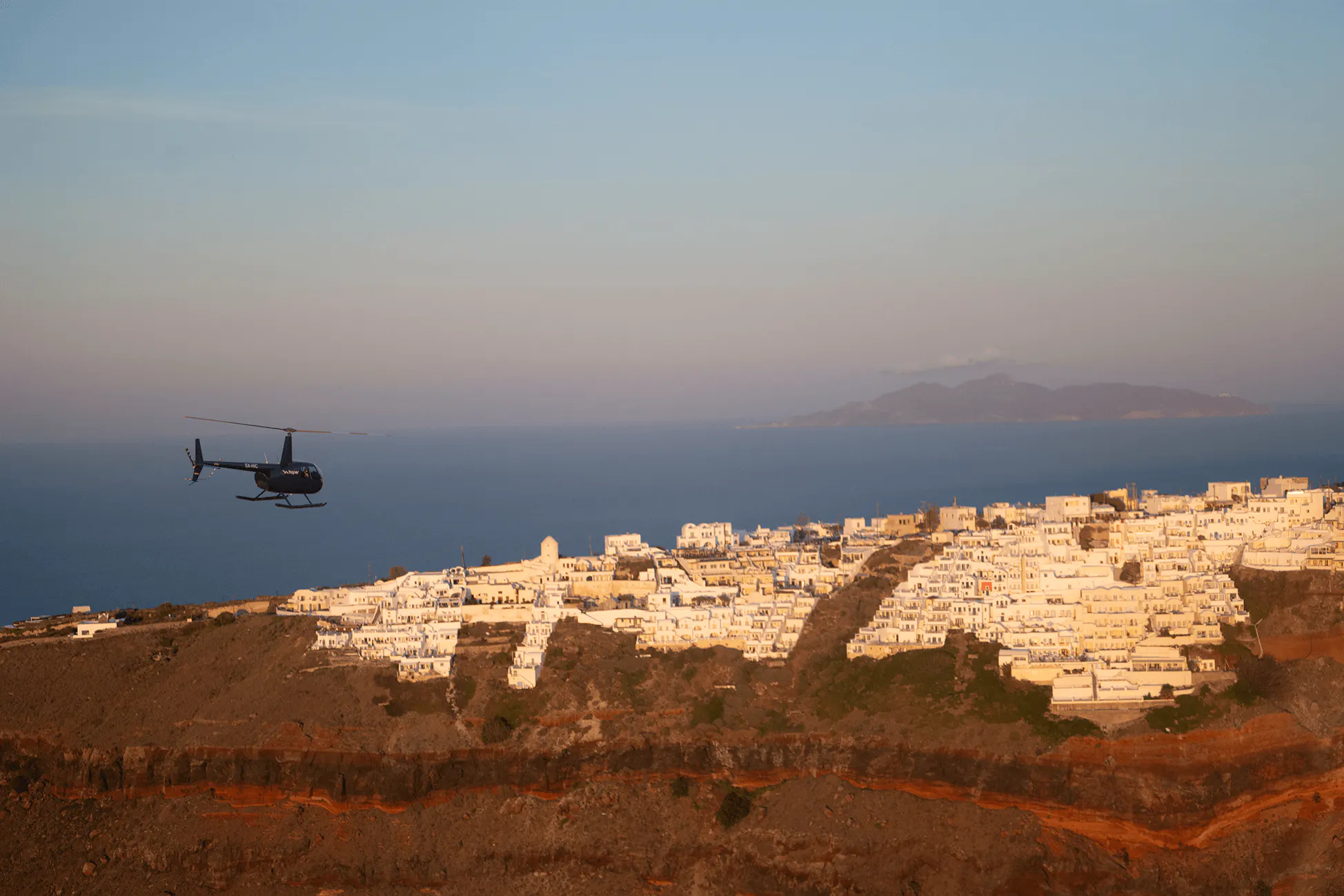 Helicopter Flying Above Santorini