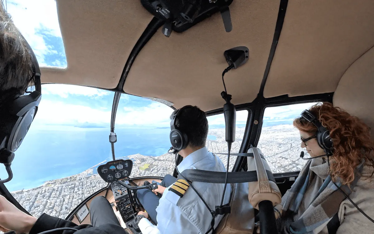 Passengers inside a helicopter over Athens