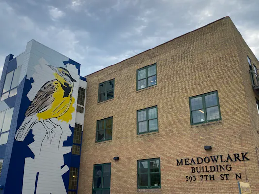 The Meadowlark Building at 503 7th Street North in downtown Fargo, with its meadowlark mural on the stair tower