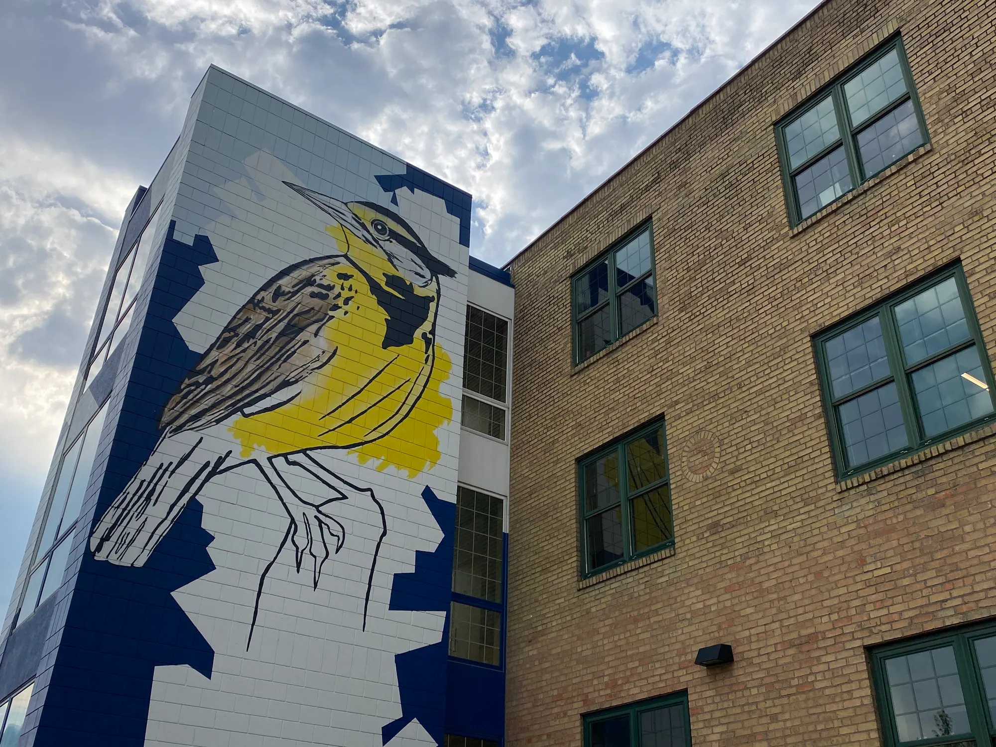 Meadowlark mural by Steve Knutson on the stair tower of the Meadowlark Building