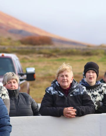 Local people come to watch the horse roundups in Iceland