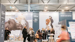 People talking to Berglind Margo Þorvaldsdóttir at Horses of Iceland's stand at Equitana