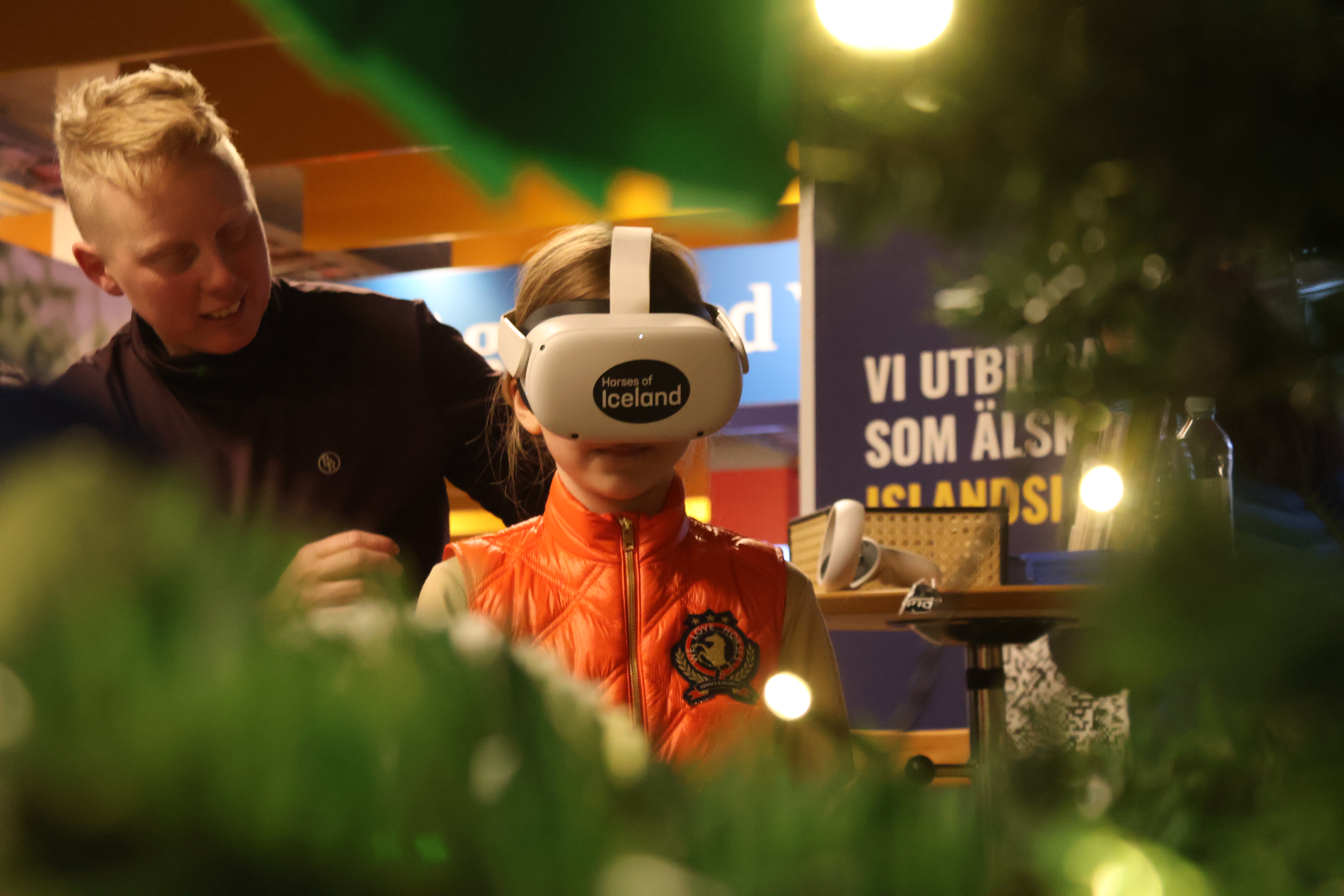 Child trying on Horses of Iceland's VR glasses at Sweden International Horses Show
