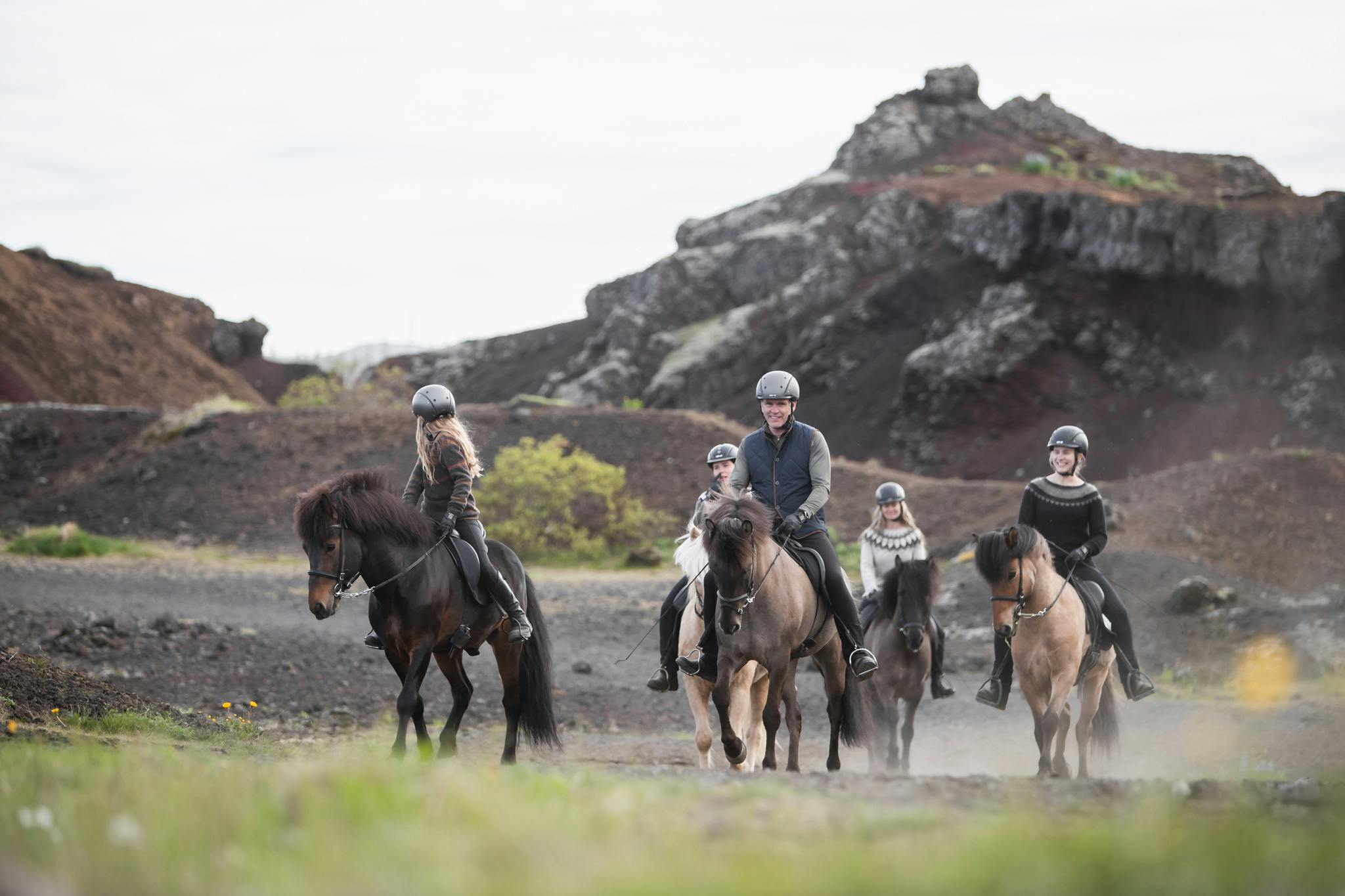 Riders and horses in Raudholar, Iceland