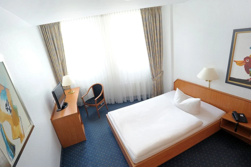 one king size bed shown in a comfortable room