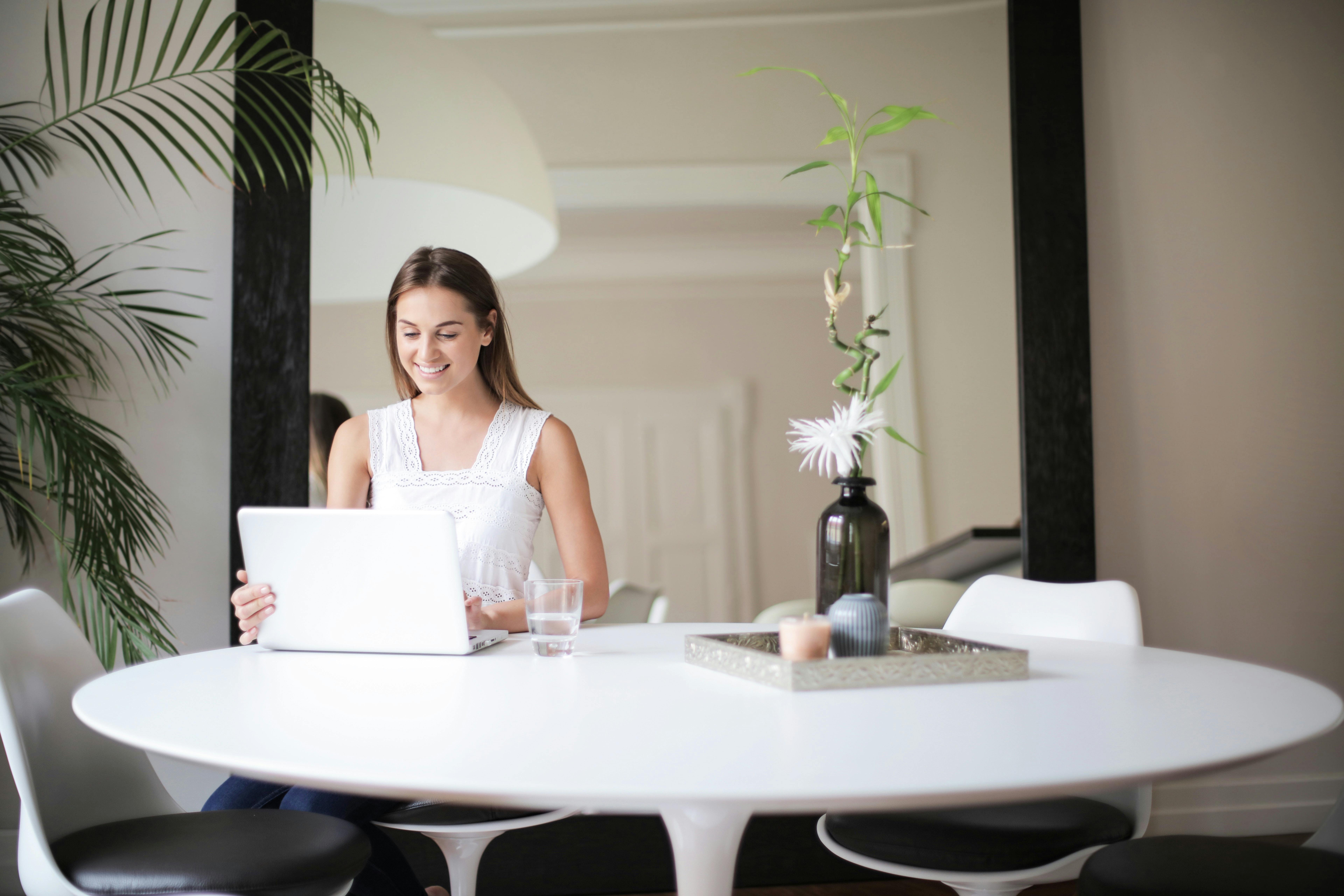 woman-in-white-sleeveless-dress-sitting