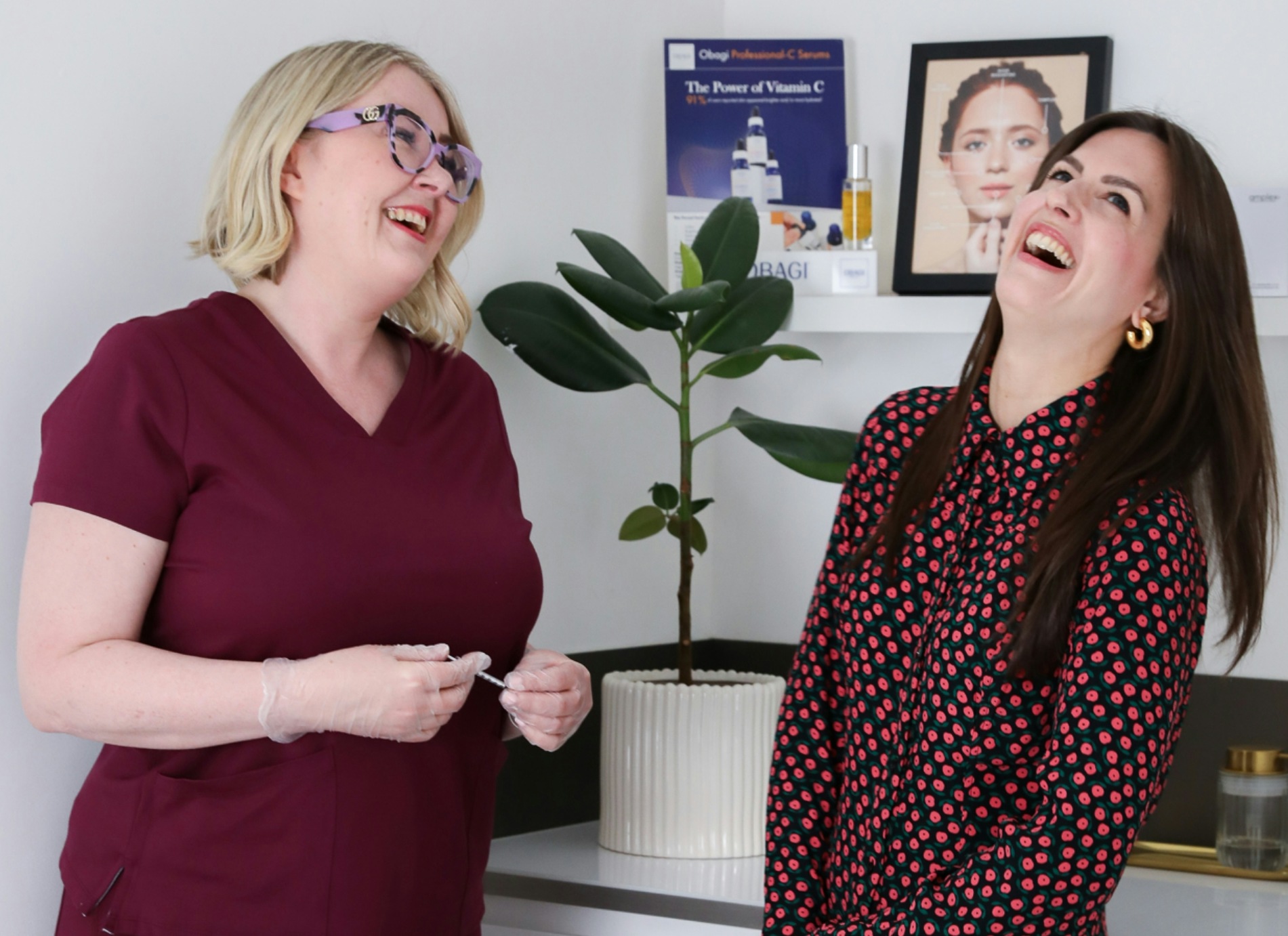 House of Glow owner laughing with a happy patient