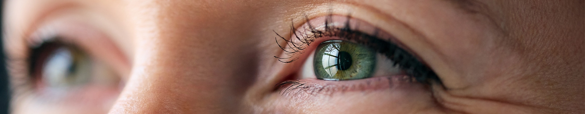 A woman with crow's feet lines and wrinkles