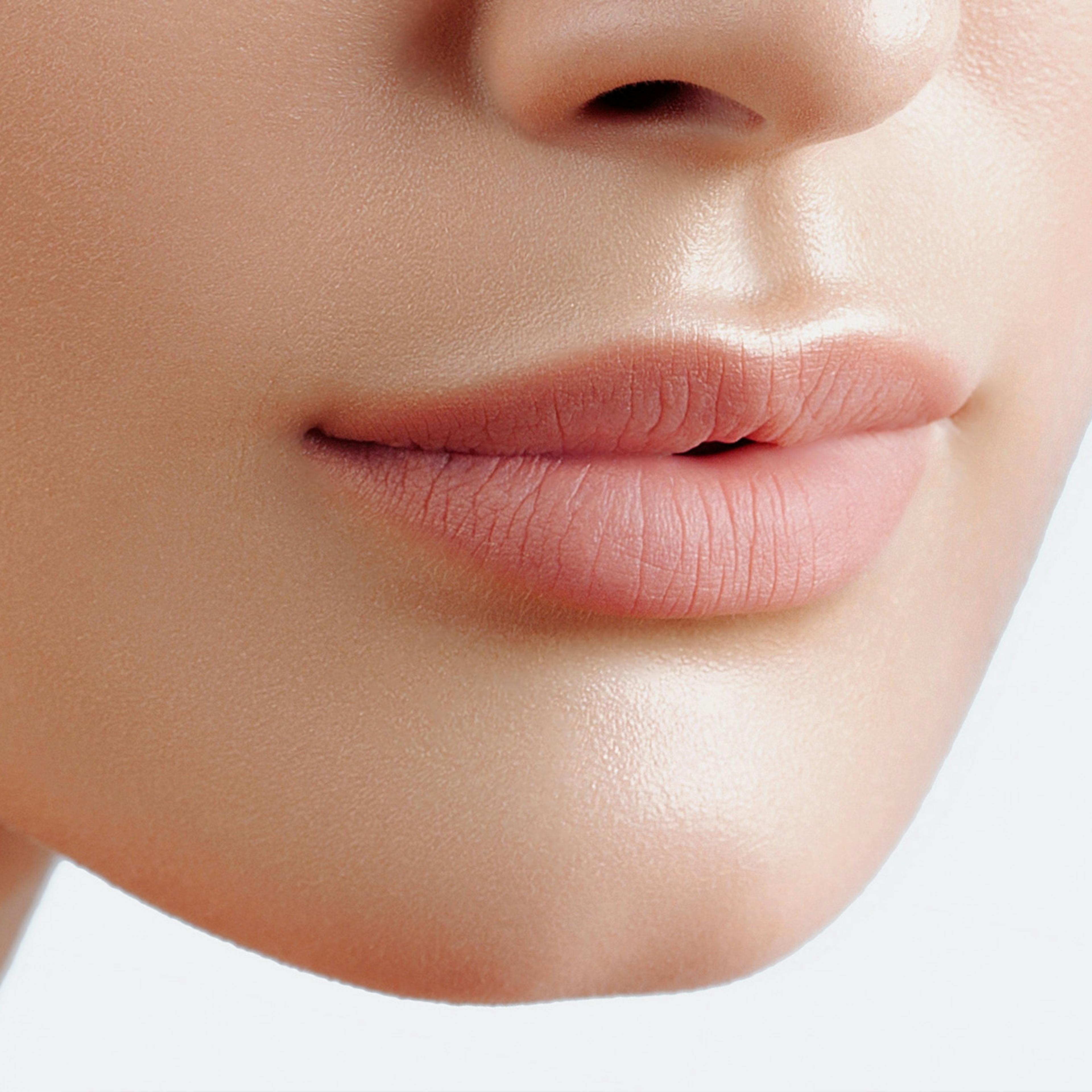 A female's lips after her dermal lip filler treatment