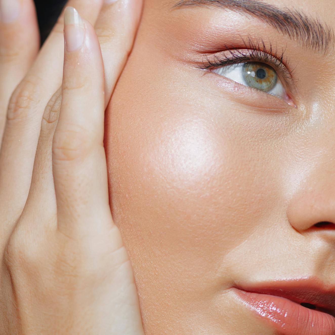 A woman with glowing, youthful skin following skin treatments and facials