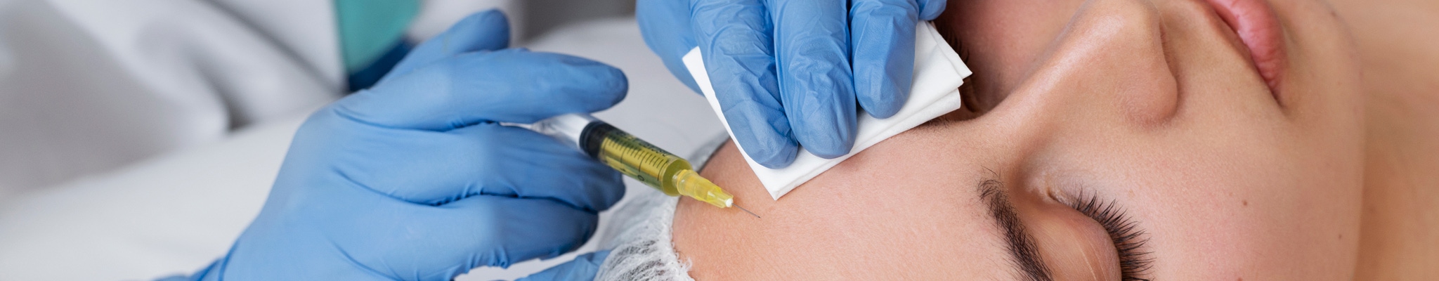 woman getting vampire facial treatment