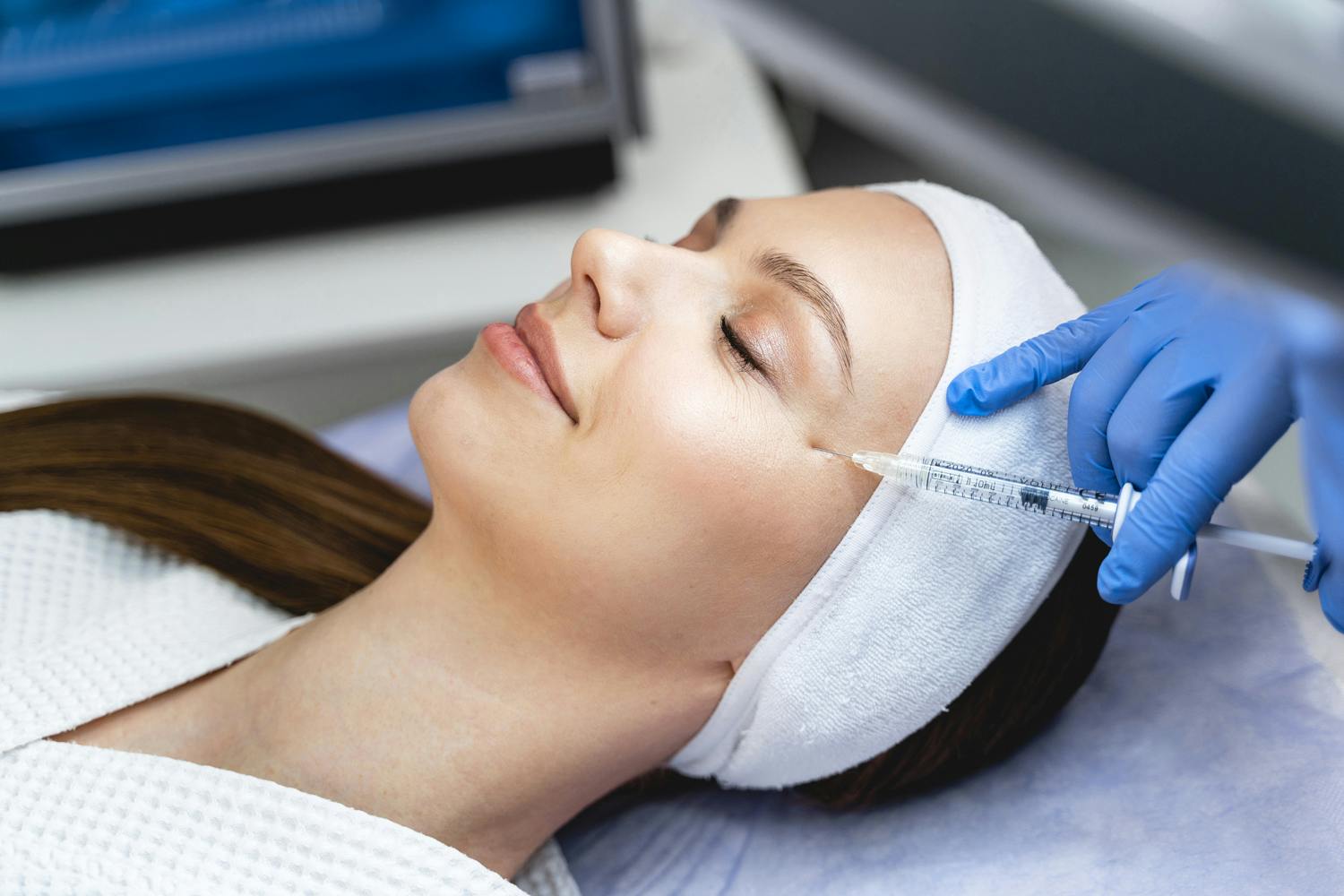 mesotox full face treatment being performed on a woman