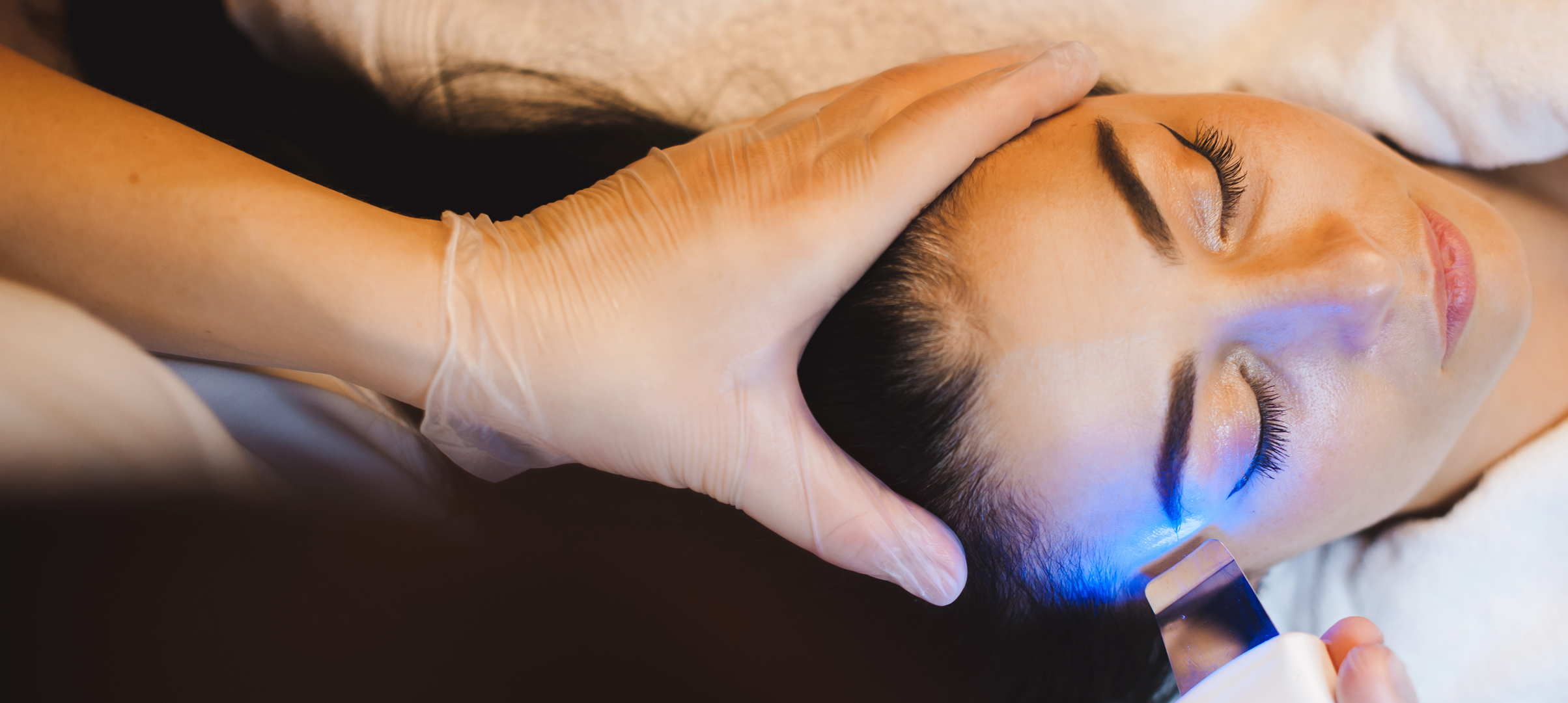Woman getting facial LED Therapy
