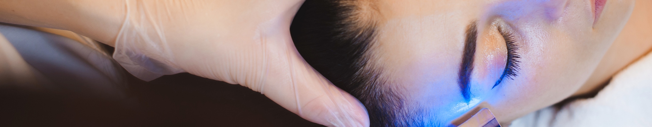 Woman getting facial LED Therapy