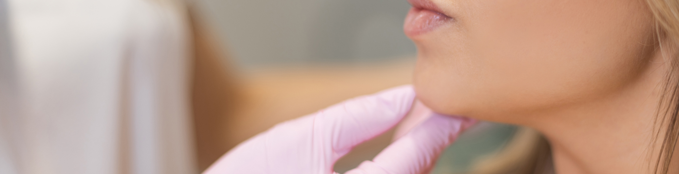 woman having jaw filler dissolving consultation