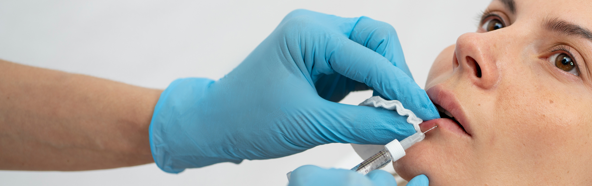 woman having lip filler dissolving treatment