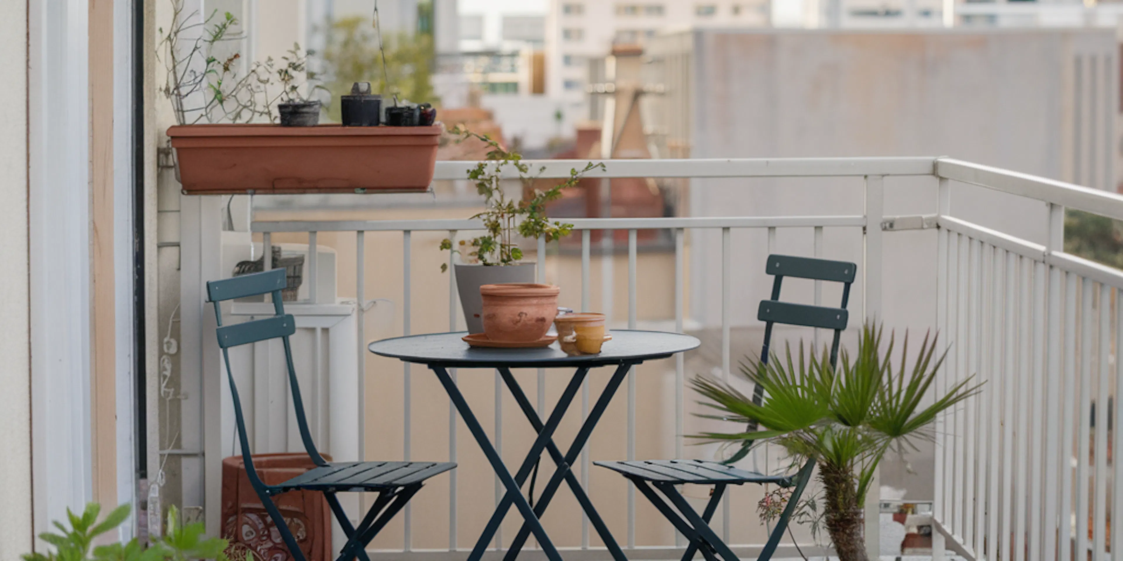 A small balcony with two chairs