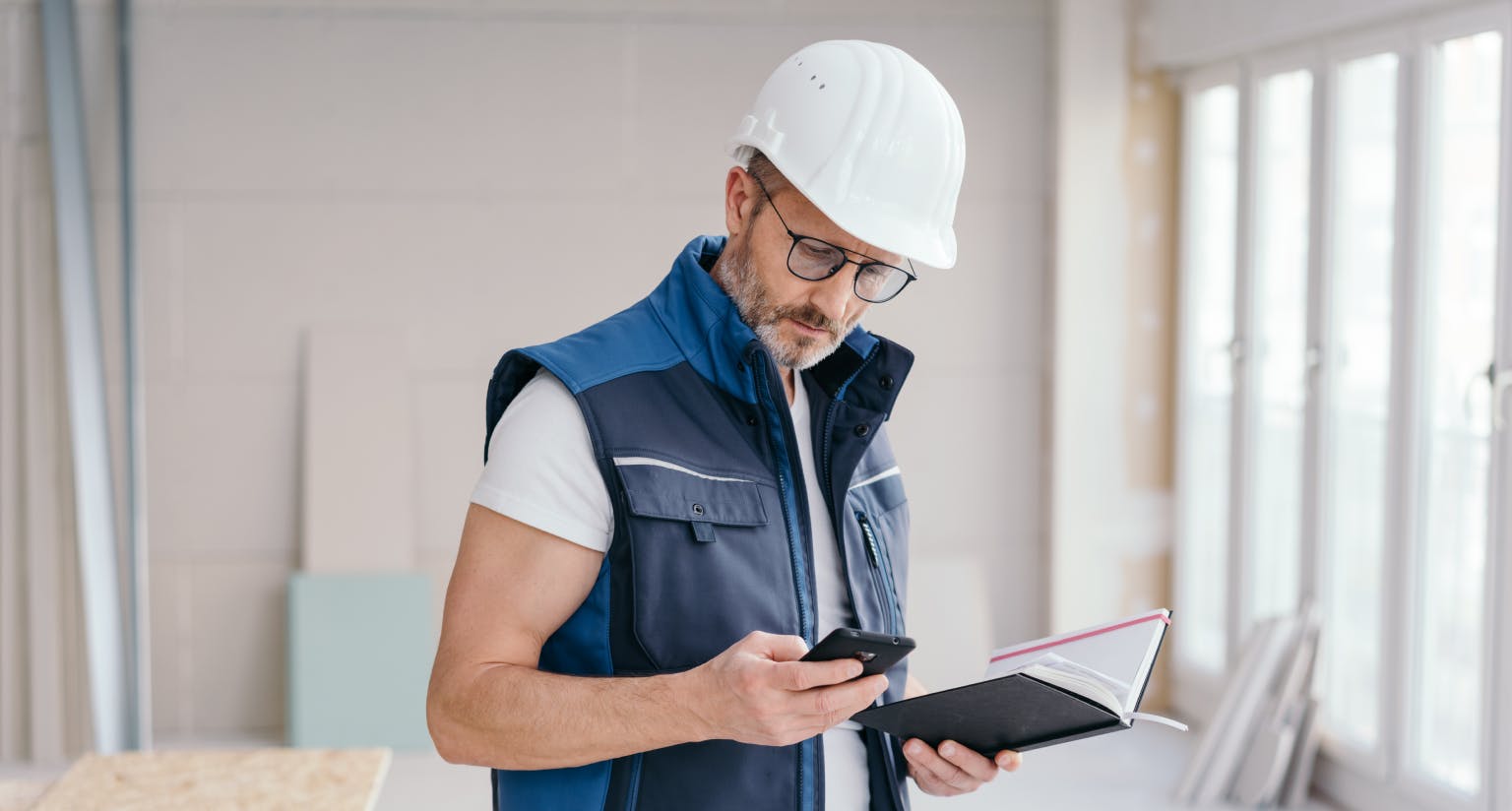 Residential general contractor looks at his business management app