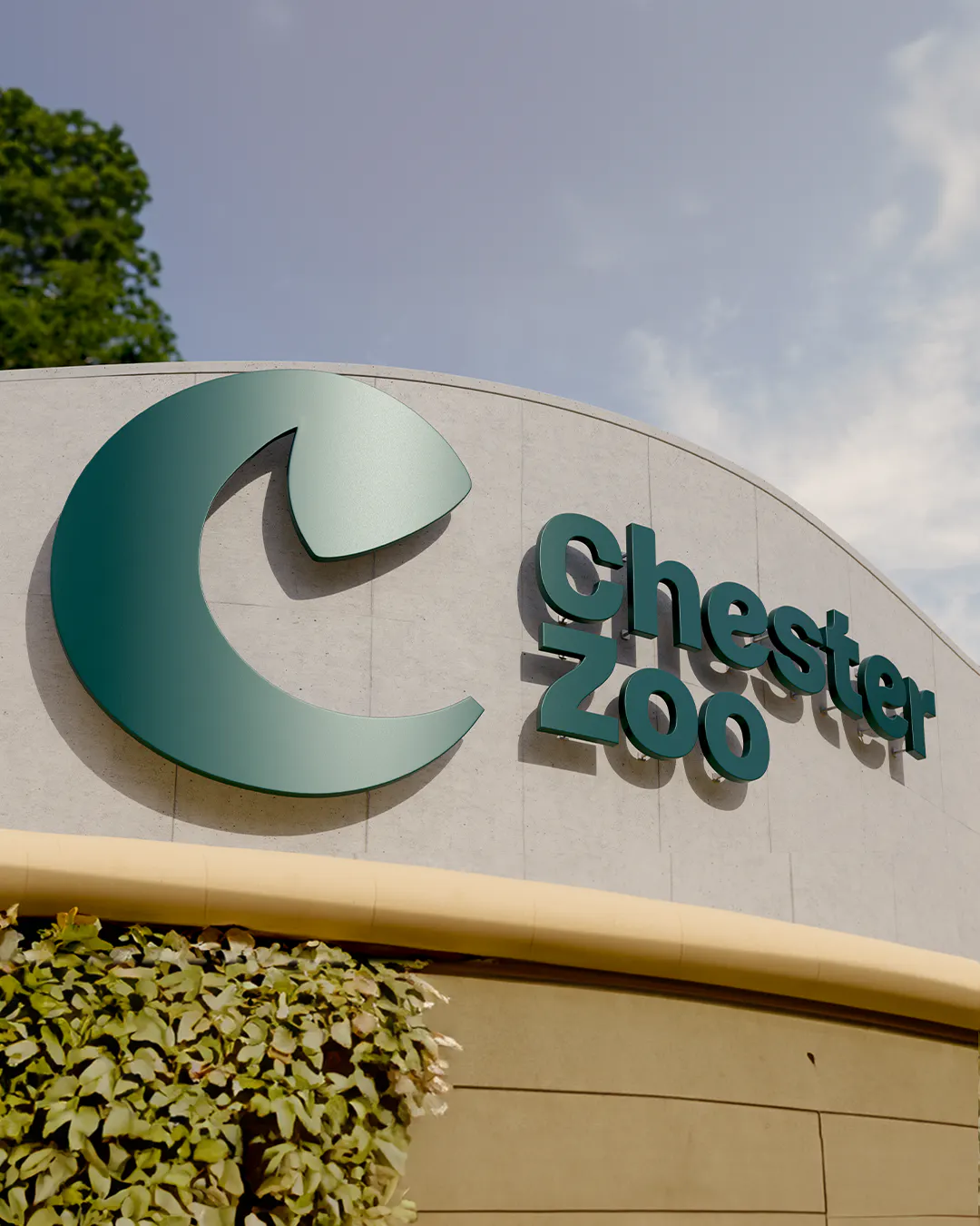 Chester Zoo entrance sign with the 'C' icon and wordmark