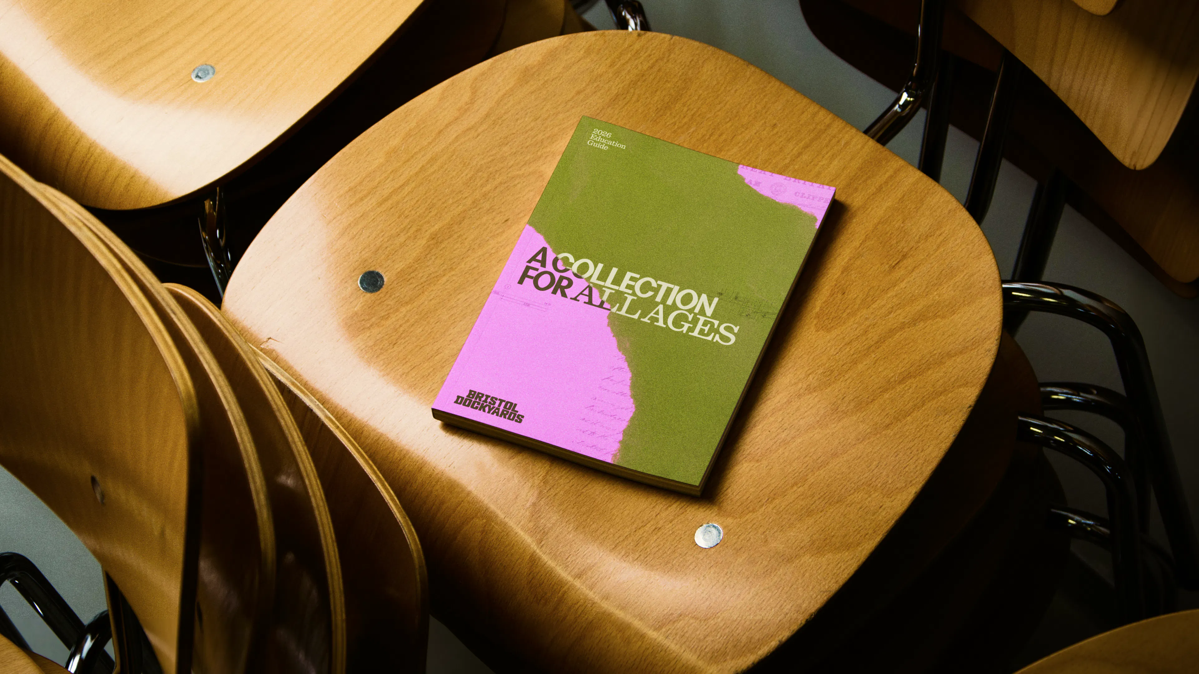 Image showing print brochure collage on a chair for Bristol Dockyards by HOW+HOW
